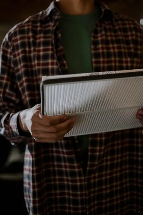 person holding replacement HVAC air filter for home system South Florida